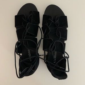 Black strappy sandals.